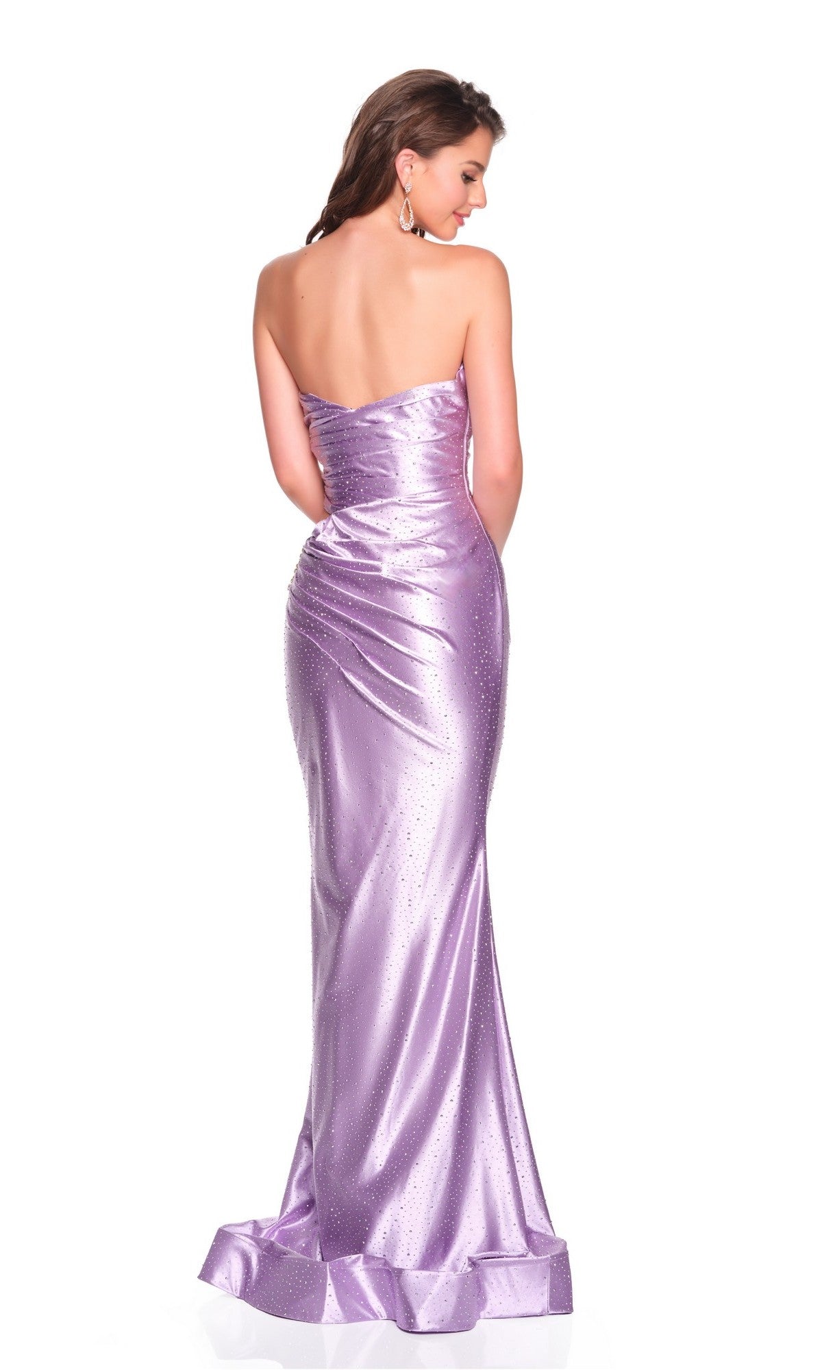 A woman faces away, wearing the Dave and Johnny 12476 long prom dressโa strapless, fitted lavender gown with a sweetheart neckline and subtle rhinestone embellishments that add sparkle to its shiny fabric.